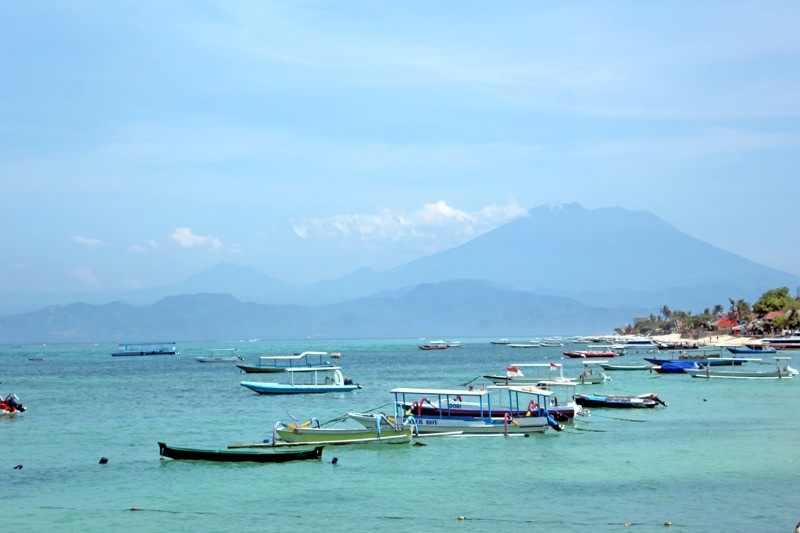 Harbour at Nusa Lembongan and view of Mount Agung in Bali
