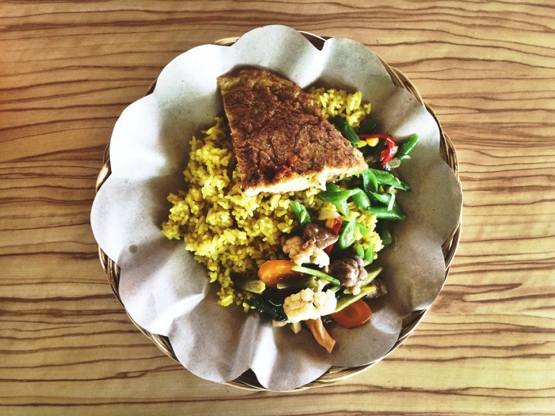 The most typical street food in Indonesia is Nasi Campur